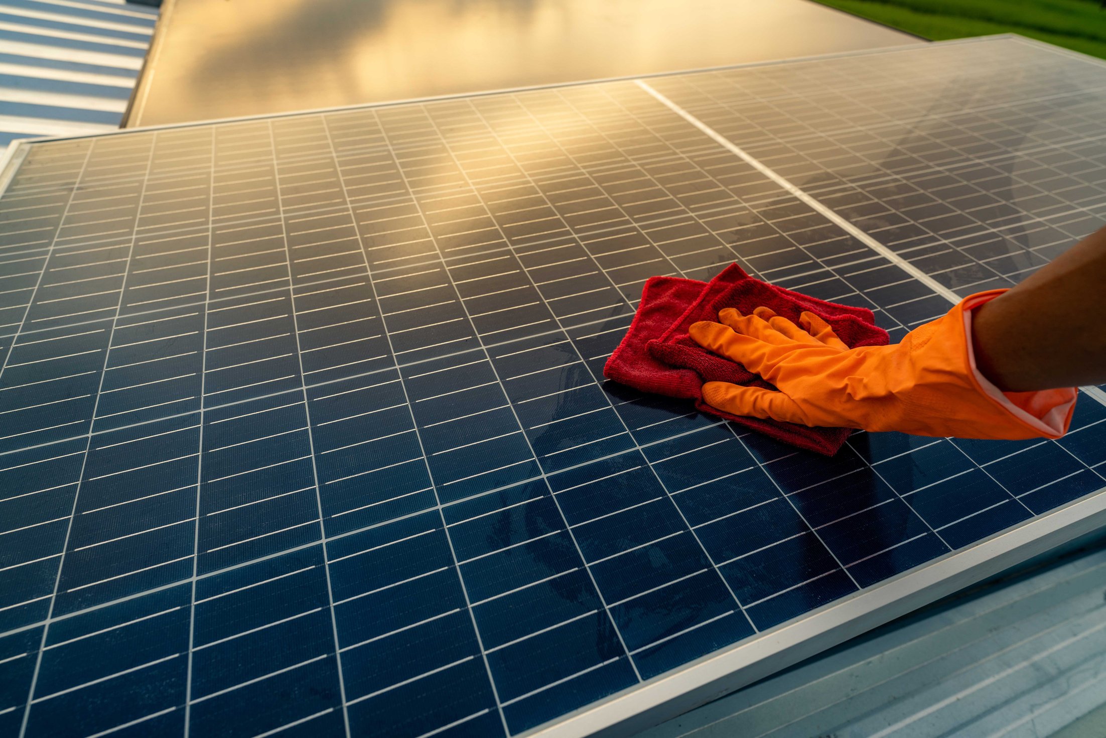 Man Cleaning Solar Panel